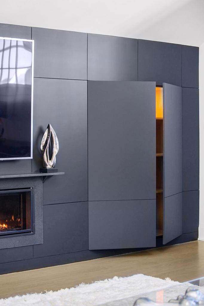 Linear fireplace surround built with textured plaster, floating timber mantel beam
